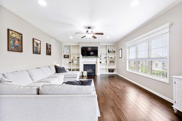 2708 Red Rock Rd, Normal, IL 61761 - living room featuring a ceiling fan, a glass covered fireplace, recessed lighting, dark wood finished floors, and baseboards