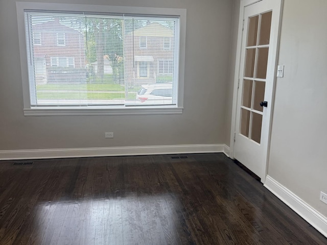 12424 S Carpenter St, Calumet Park, IL 60827 - empty room featuring baseboards and dark wood-style flooring