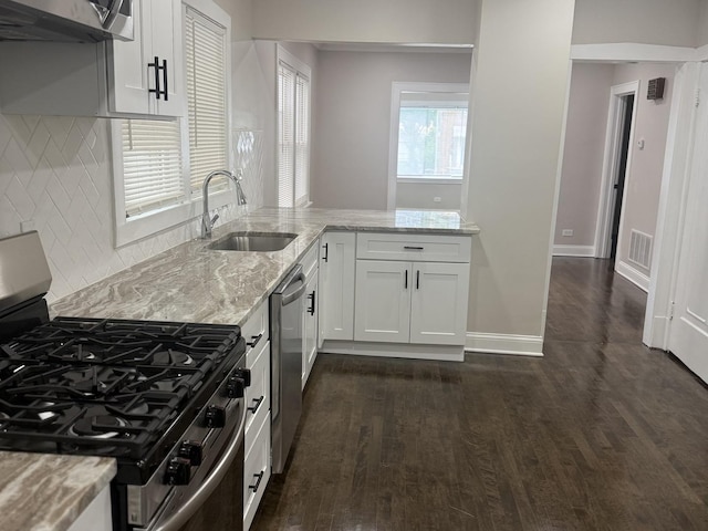 12424 S Carpenter St, Calumet Park, IL 60827 - kitchen with stainless steel appliances, a sink, dark wood-type flooring, light stone counters, and white cabinetry