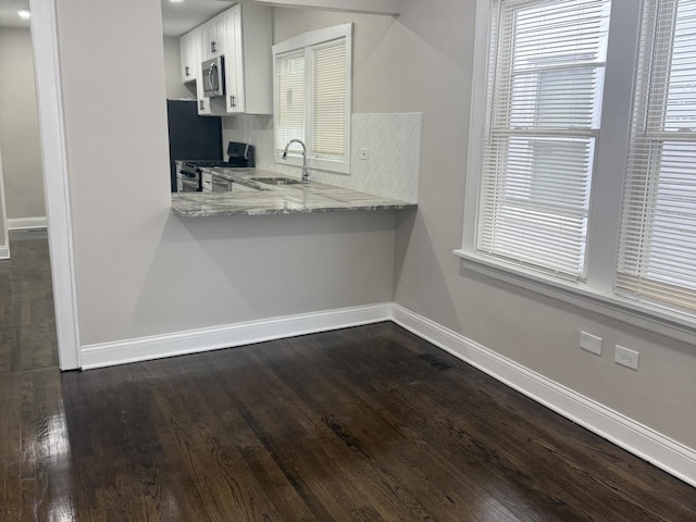 12424 S Carpenter St, Calumet Park, IL 60827 - kitchen featuring appliances with stainless steel finishes, a sink, baseboards, dark wood-type flooring, and white cabinets
