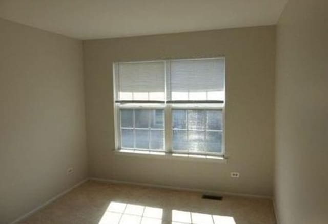 7254 Terrace Dr Unit 47, Justice, IL 60458 - carpeted spare room with baseboards