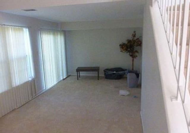 7254 Terrace Dr Unit 47, Justice, IL 60458 - carpeted empty room featuring stairway