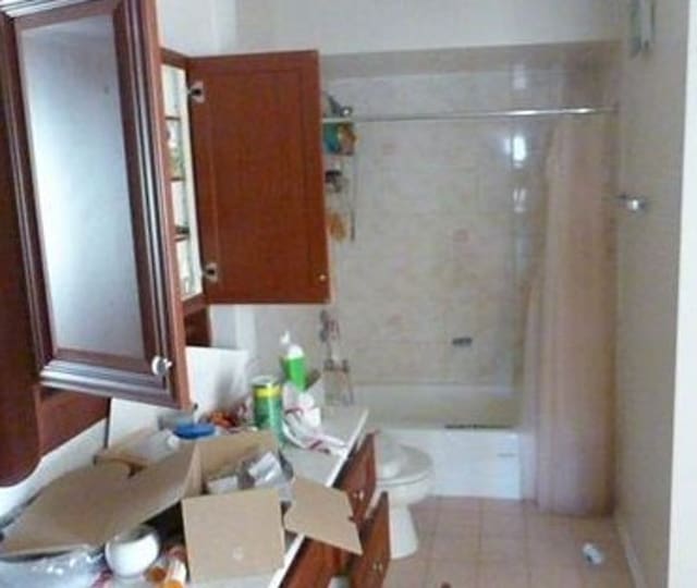 7254 Terrace Dr Unit 47, Justice, IL 60458 - full bathroom with toilet, vanity, shower / tub combination, and tile patterned floors