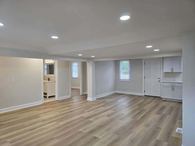 2524 Gray Ct, Waukegan, IL 60085 - basement with baseboards, recessed lighting, light wood finished floors, and healthy amount of natural light