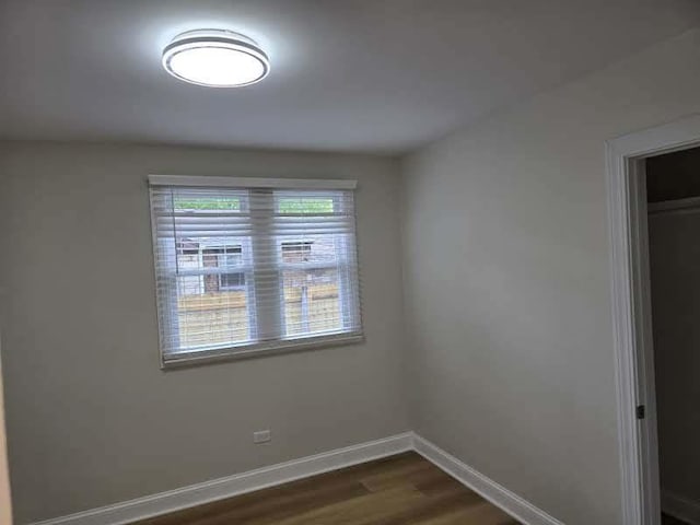 2524 Gray Ct, Waukegan, IL 60085 - empty room with dark wood-style flooring and baseboards