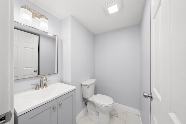 11522 S Parnell Ave, Chicago, IL 60628 - half bathroom featuring vanity, baseboards, toilet, and marble look tiles