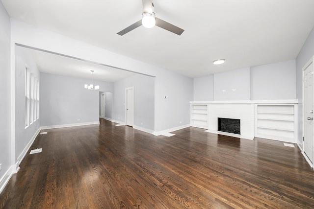 11522 S Parnell Ave, Chicago, IL 60628 - unfurnished living room featuring a chandelier, a fireplace, ceiling fan, dark wood finished floors, and baseboards