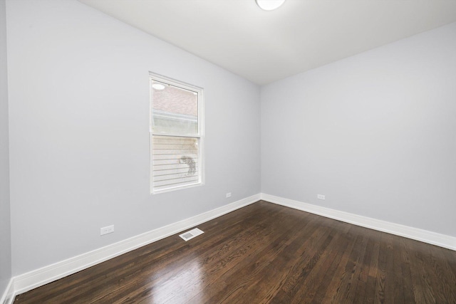 11522 S Parnell Ave, Chicago, IL 60628 - unfurnished room with dark wood finished floors and baseboards
