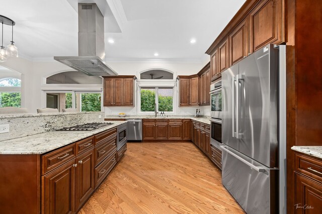 4103 Douglas Rd, Downers Grove, IL 60515 - kitchen with appliances with stainless steel finishes, island range hood, ornamental molding, light wood-style flooring, and light stone counters