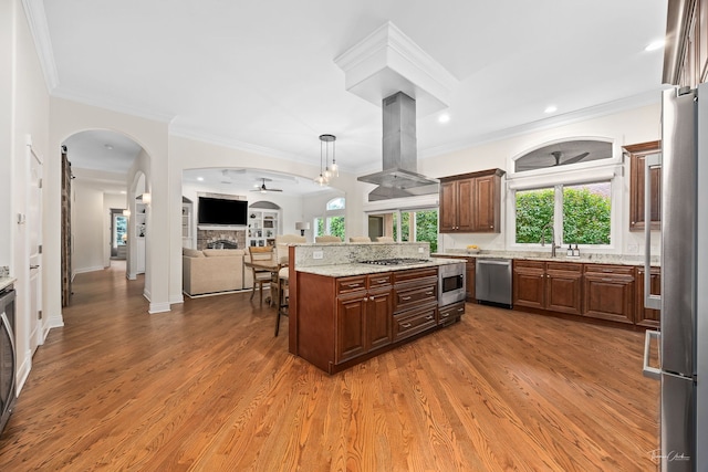 4103 Douglas Rd, Downers Grove, IL 60515 - kitchen with appliances with stainless steel finishes, island range hood, open floor plan, light stone countertops, and wood finished floors