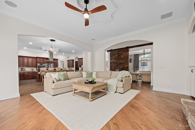 4103 Douglas Rd, Downers Grove, IL 60515 - living area with arched walkways, a ceiling fan, light wood-type flooring, crown molding, and recessed lighting