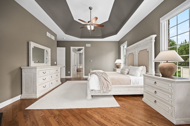 4103 Douglas Rd, Downers Grove, IL 60515 - bedroom featuring a tray ceiling, dark wood finished floors, and ceiling fan