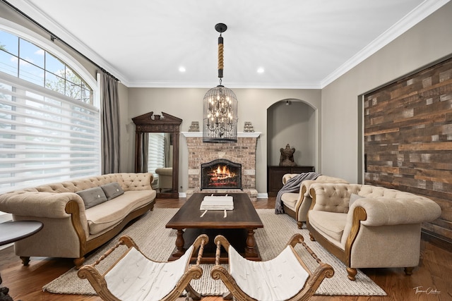 4103 Douglas Rd, Downers Grove, IL 60515 - living area featuring wood finished floors, a brick fireplace, ornamental molding, a chandelier, and recessed lighting
