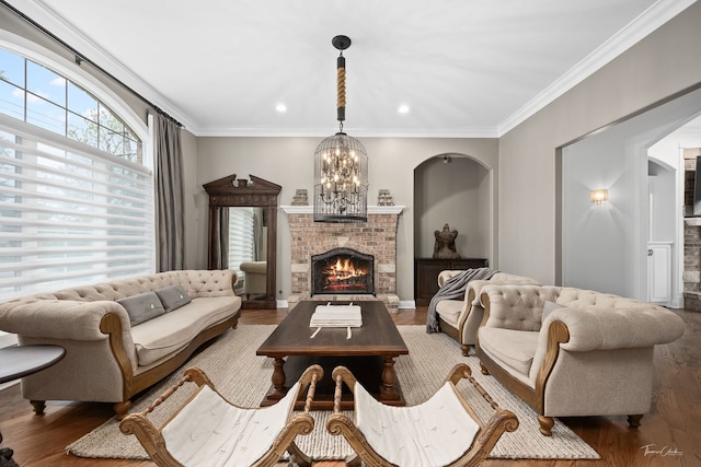 4103 Douglas Rd, Downers Grove, IL 60515 - living area with a fireplace, wood finished floors, ornamental molding, a chandelier, and recessed lighting