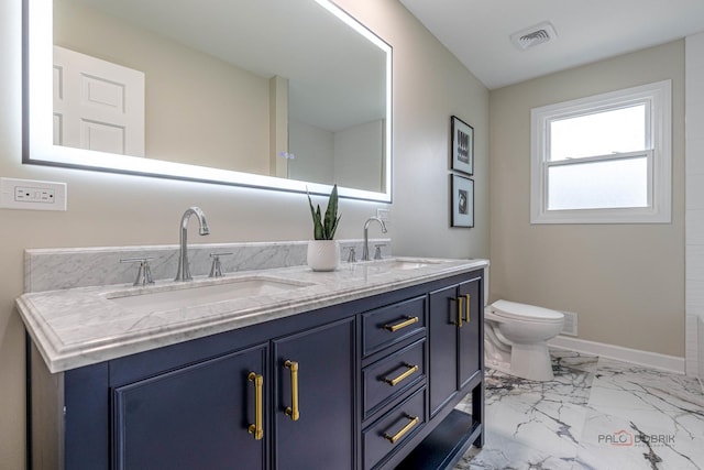 8 Pheasant Row, Lincolnshire, IL 60069 - bathroom with double vanity, marble look tiles, toilet, and baseboards