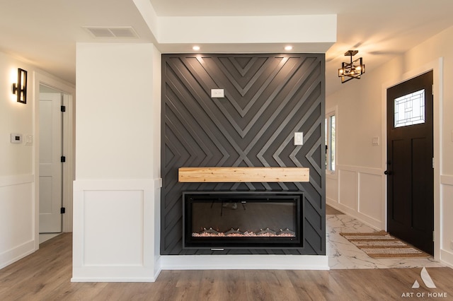 9859 S 81st Ave, Palos Hills, IL 60465 - detailed view of a decorative wall, a fireplace, and a chandelier