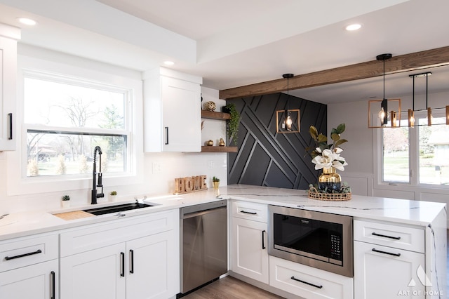9859 S 81st Ave, Palos Hills, IL 60465 - kitchen featuring stainless steel dishwasher, black microwave, a sink, a peninsula, and open shelves