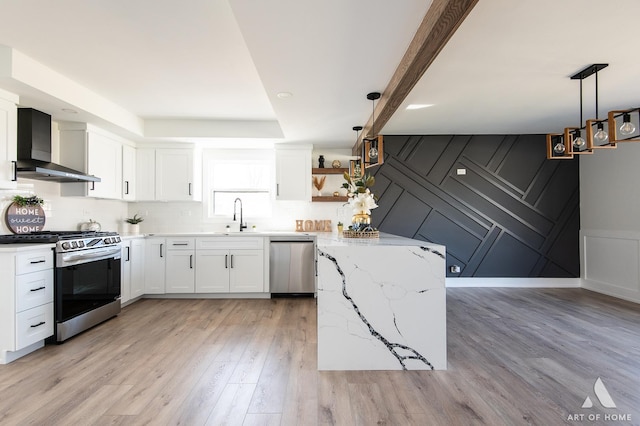 9859 S 81st Ave, Palos Hills, IL 60465 - kitchen with wall chimney exhaust hood, appliances with stainless steel finishes, a decorative wall, open shelves, and light stone countertops