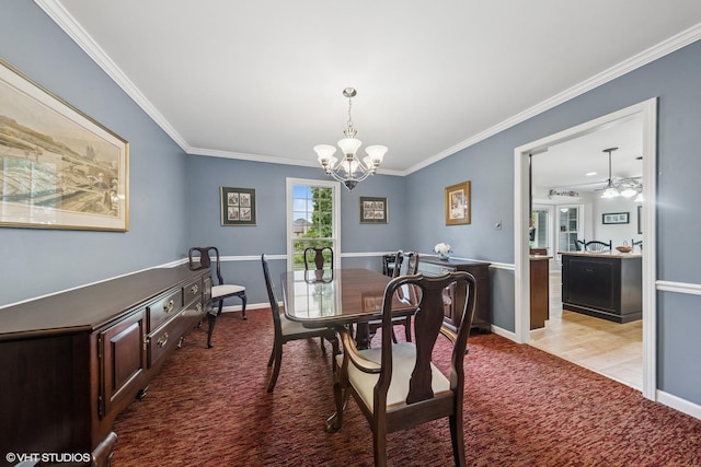2139 Riverlea Cir, Naperville, IL 60565 - carpeted dining area featuring a chandelier, crown molding, baseboards, and ceiling fan