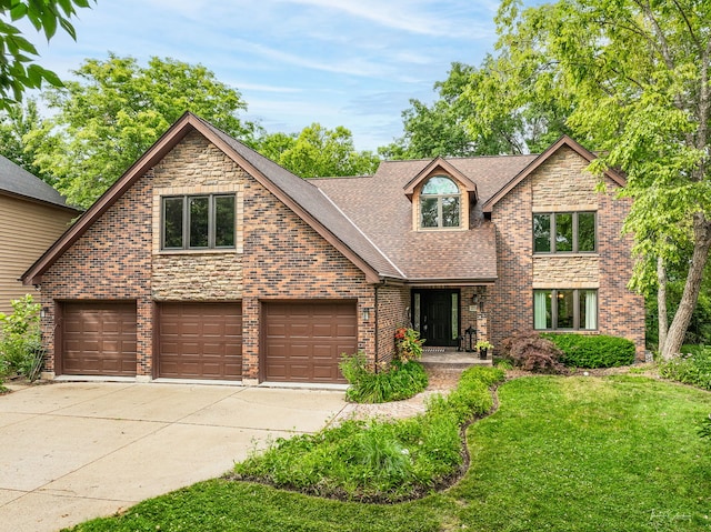 2734 Alyssa Dr, Naperville, IL 60565 - view of front of property with concrete driveway, a front lawn, a shingled roof, and brick siding