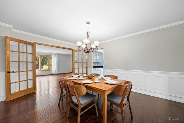 2734 Alyssa Dr, Naperville, IL 60565 - dining room featuring a chandelier, ornamental molding, dark wood finished floors, wainscoting, and a decorative wall