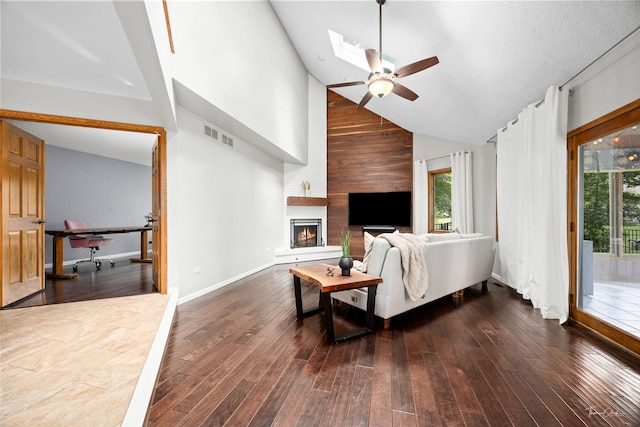 2734 Alyssa Dr, Naperville, IL 60565 - living area featuring high vaulted ceiling, ceiling fan, plenty of natural light, dark wood finished floors, and a skylight