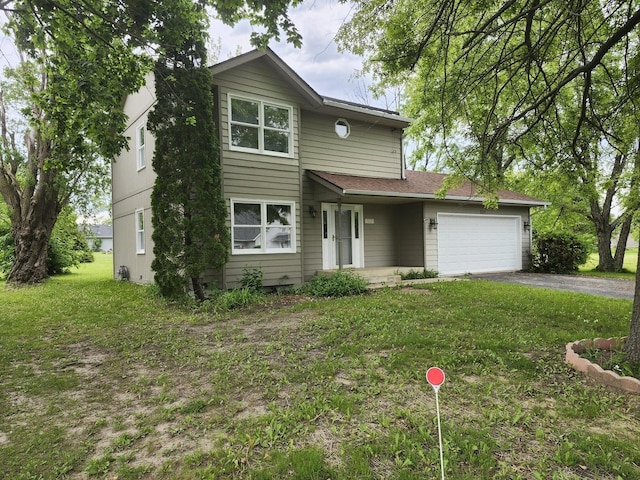 508 Pembroke Rd SW, Poplar Grove, IL 61065 - traditional-style home featuring an attached garage, asphalt driveway, and a front lawn