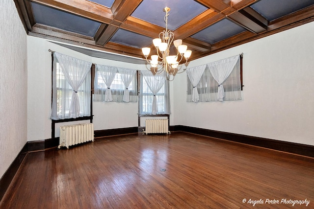 704 N Division St, Harvard, IL 60033 - unfurnished room featuring radiator heating unit, a chandelier, wood finished floors, baseboards, and beam ceiling