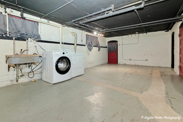 704 N Division St, Harvard, IL 60033 - unfinished basement featuring separate washer and dryer and a sink