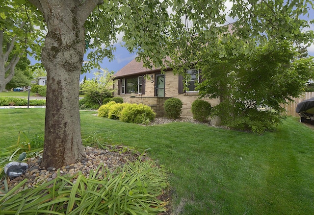 731 Marcy St, Ottawa, IL 61350 - obstructed view of property featuring brick siding and a front yard