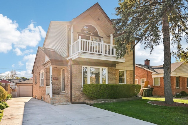 8252 N Caldwell Ave, Niles, IL 60714 - view of front of home with a balcony, brick siding, a front yard, a garage, and an outdoor structure