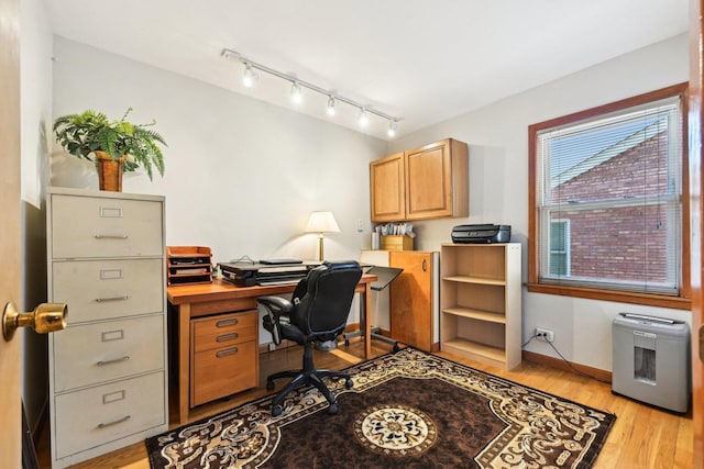 8252 N Caldwell Ave, Niles, IL 60714 - home office with rail lighting, light wood finished floors, and baseboards