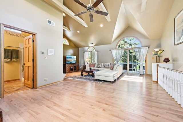 8252 N Caldwell Ave, Niles, IL 60714 - living area featuring a ceiling fan, high vaulted ceiling, light wood finished floors, and baseboards