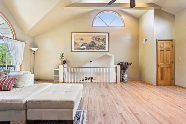 8252 N Caldwell Ave, Niles, IL 60714 - bedroom with light wood-style floors, baseboards, and high vaulted ceiling
