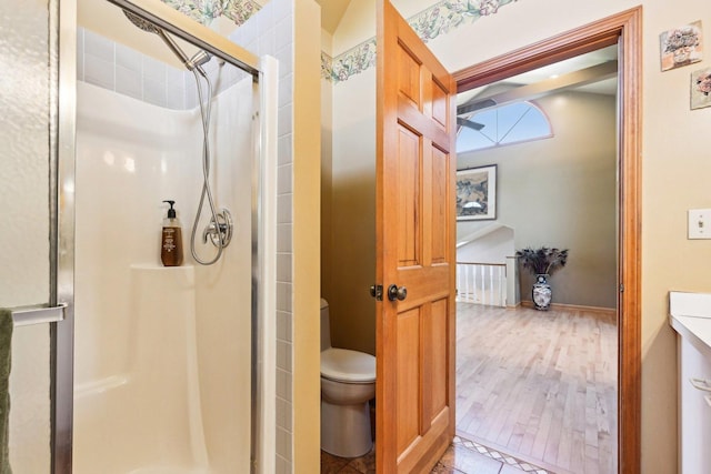 8252 N Caldwell Ave, Niles, IL 60714 - full bath with a shower stall, toilet, wood finished floors, and baseboards