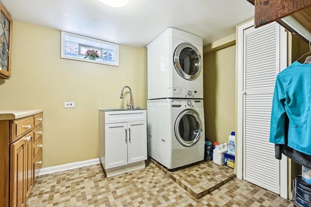 8252 N Caldwell Ave, Niles, IL 60714 - washroom featuring stacked washer and clothes dryer, cabinet space, and baseboards