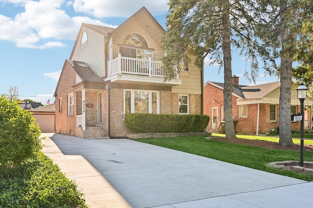 8252 N Caldwell Ave, Niles, IL 60714 - view of front of property featuring a balcony, brick siding, a front lawn, and a garage