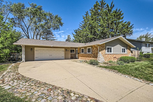1360 Gentry Rd, Hoffman Estates, IL 60169 - ranch-style house with brick siding, an attached garage, and driveway