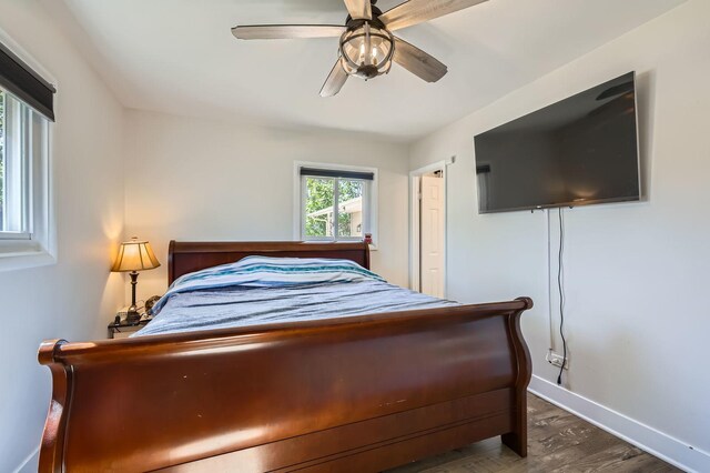 1360 Gentry Rd, Hoffman Estates, IL 60169 - bedroom with dark wood-style floors, baseboards, and ceiling fan