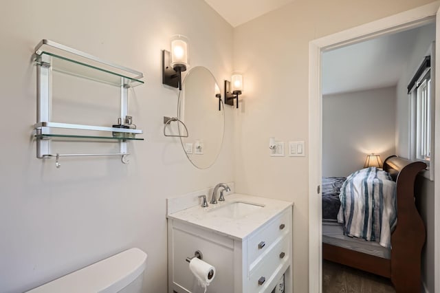 1360 Gentry Rd, Hoffman Estates, IL 60169 - half bath featuring vanity, toilet, and wood finished floors