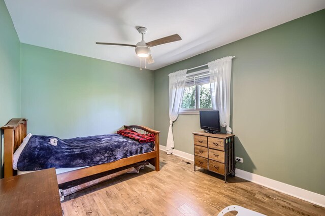 1360 Gentry Rd, Hoffman Estates, IL 60169 - bedroom featuring wood finished floors, baseboards, and ceiling fan