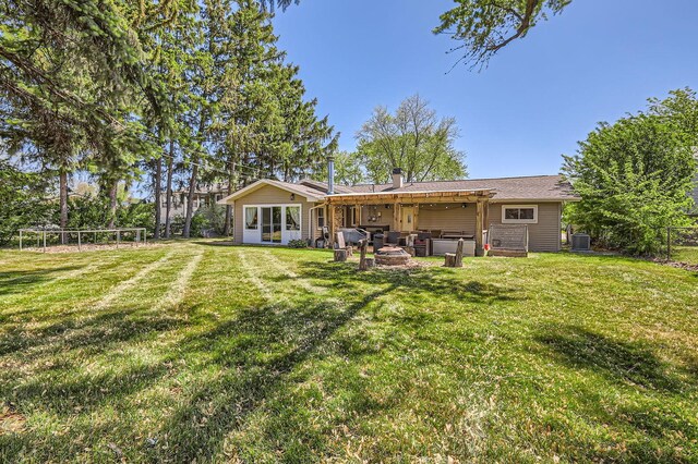 1360 Gentry Rd, Hoffman Estates, IL 60169 - back of house with central AC, a patio area, and a fire pit