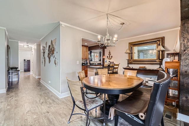 1360 Gentry Rd, Hoffman Estates, IL 60169 - dining room featuring crown molding, a chandelier, light wood-type flooring, and baseboards