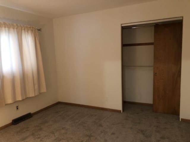 6100 S Parkside Ave, Chicago, IL 60638 - unfurnished bedroom featuring carpet, a closet, and baseboards