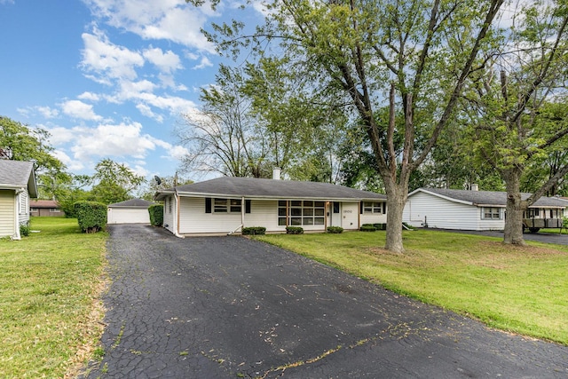 19011 John Ave, Country Club Hills, IL 60478 - ranch-style home with a front lawn, an outdoor structure, a chimney, and a detached garage