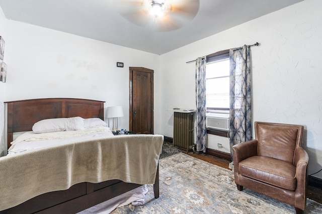 4109 W Oakdale Ave, Chicago, IL 60641 - bedroom with wood finished floors, ceiling fan, and baseboards