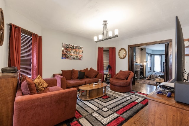 4109 W Oakdale Ave, Chicago, IL 60641 - living room featuring wood finished floors and a chandelier