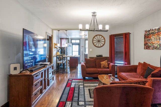 4109 W Oakdale Ave, Chicago, IL 60641 - living room with wood finished floors and a chandelier
