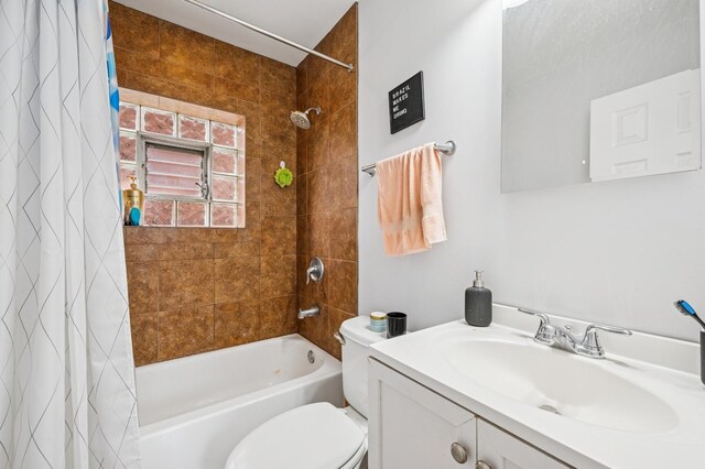 3430 S Parnell Ave, Chicago, IL 60616 - bathroom featuring shower / bathtub combination with curtain, toilet, and vanity