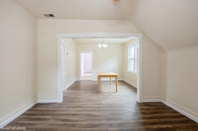 2109 N Long Ave, Chicago, IL 60639 - bonus room with dark wood finished floors, vaulted ceiling, a chandelier, and baseboards